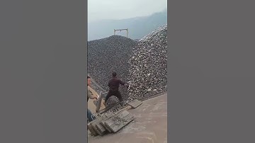 Unloading Pebbles from a Cargo Ship - Good tools and machinery make work easy
