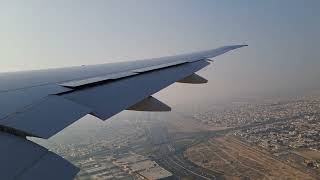 Scenic Dubai Take-off: Emirates B777 *wing view of the city*