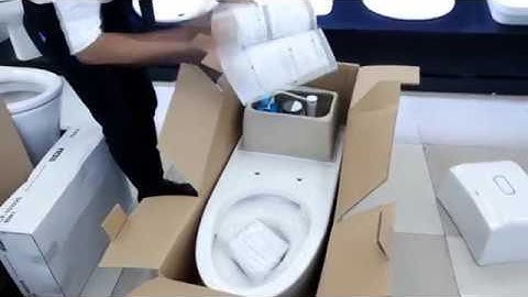 Đập hộp bàn cầu một khối INAX AC 1032VN