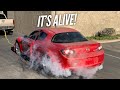 Pulling the crashed RX-8 until it starts.