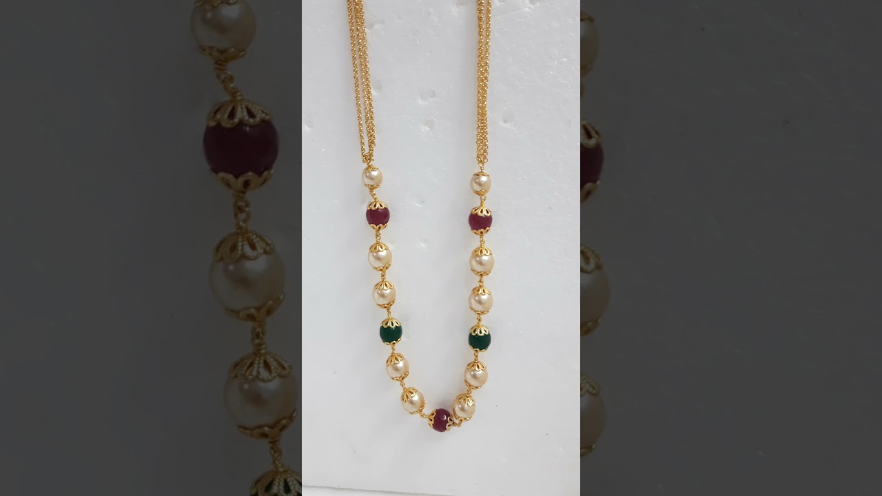 Gold chain with pearls, ruby and emerald balls