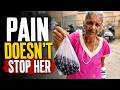 Despite fractured arm, 60-year-old Woman Continues Daily Struggle for Livelihood
