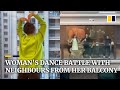 Coronavirus: Chinese woman starts dance battle with neighbours from her balcony