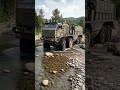 Military Mastodon Tactical Truck Crossing a Rocky River Like It Is Nothing