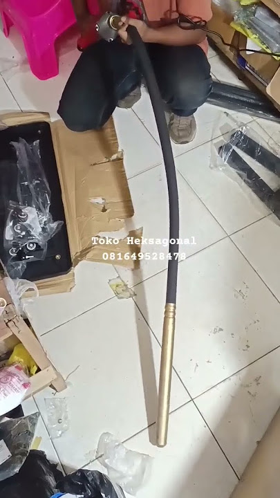 Alat Vibrator Perata Beton peralatan konstruksi yang digunakan untuk meratakan memadatkan beton