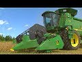 Giant John Deere Combines Harvesting Fields Of Grain from Farm Country Ahead