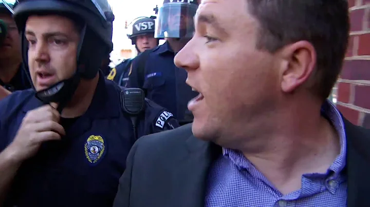 Charlottesville rally organizer flees news confere...