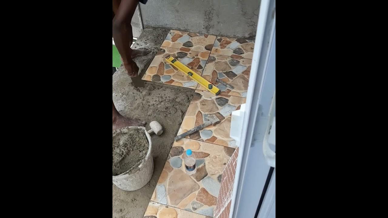Building my house in Jamaica part 43 Tiling my front & back patio