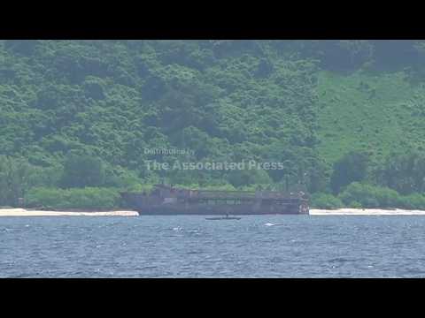 Rescuers pull more bodies from burned Philippine ferry as death toll rises