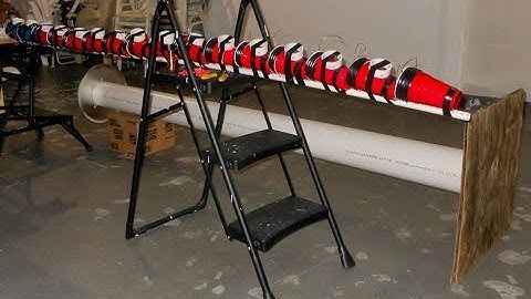 Sliding The Capacitors & Spark Gaps Into The Marx Generator Housing