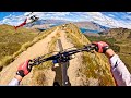 Insane heli biking down a full mountain ridge line