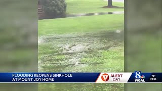 Flooding reopens sinkhole at Mount Joy home