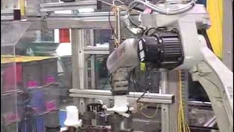 Motoman SV3X robot assembling motors