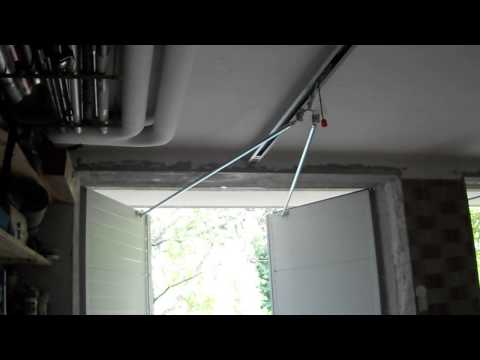 Video: Kako uravnotežiti garažna vrata s torzijskom oprugom?