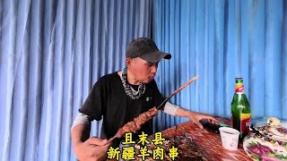 几百公里高温天气，骑自行车穿越新疆沙漠，抵达且末县犒劳一下 #高温天气 #骑自行车穿越新疆沙漠 #且末县 #新疆羊肉窜 #沙漠公路