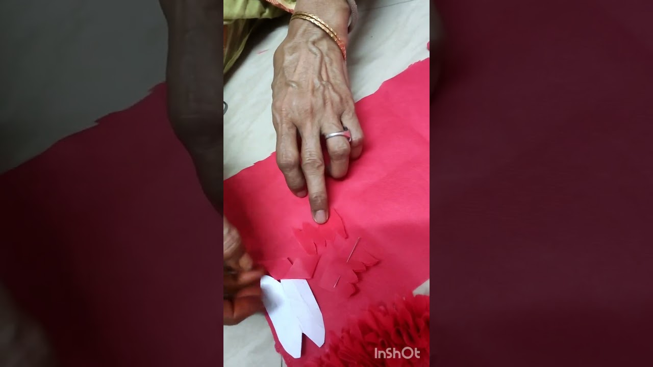 flower mala making with red cotton waste bags .