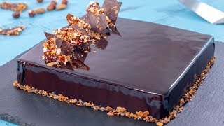 ... - a hazelnut and almond dacquoise topped with crunchy praline,
covered in chocolate mousse cocoa mirror glaze. what not to
