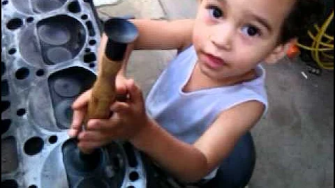 David Helping Daddy rebuild the engine (Engine Valve Lapping ) part 1