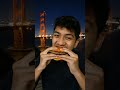 Burger eating🍔🌉 #BurgerLovers #EpicBite #FoodieShorts
