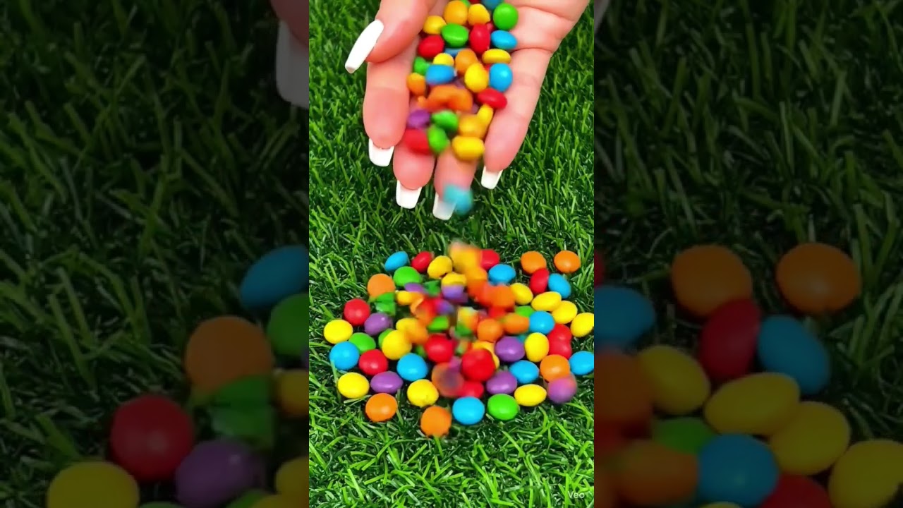 pouring lot's of colourful rainbow candy sweet ASMR 