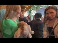 Adults hang out with goats at the Goat and Greet
