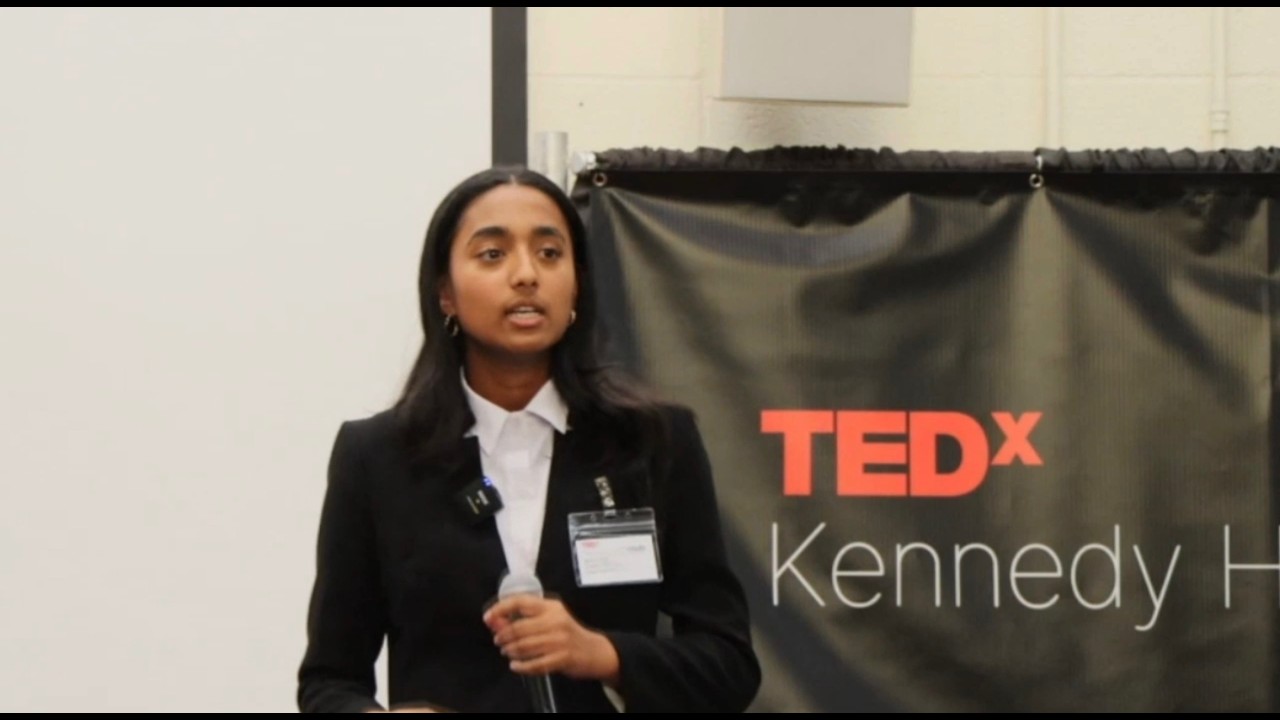 Niha Goel speaking on the TEDxKennedy High stage