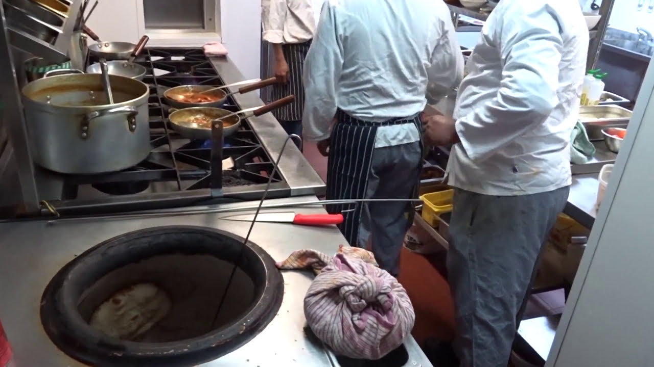 Indian Restaurant Kitchen: Very Busy and Fast Action at Taste of India