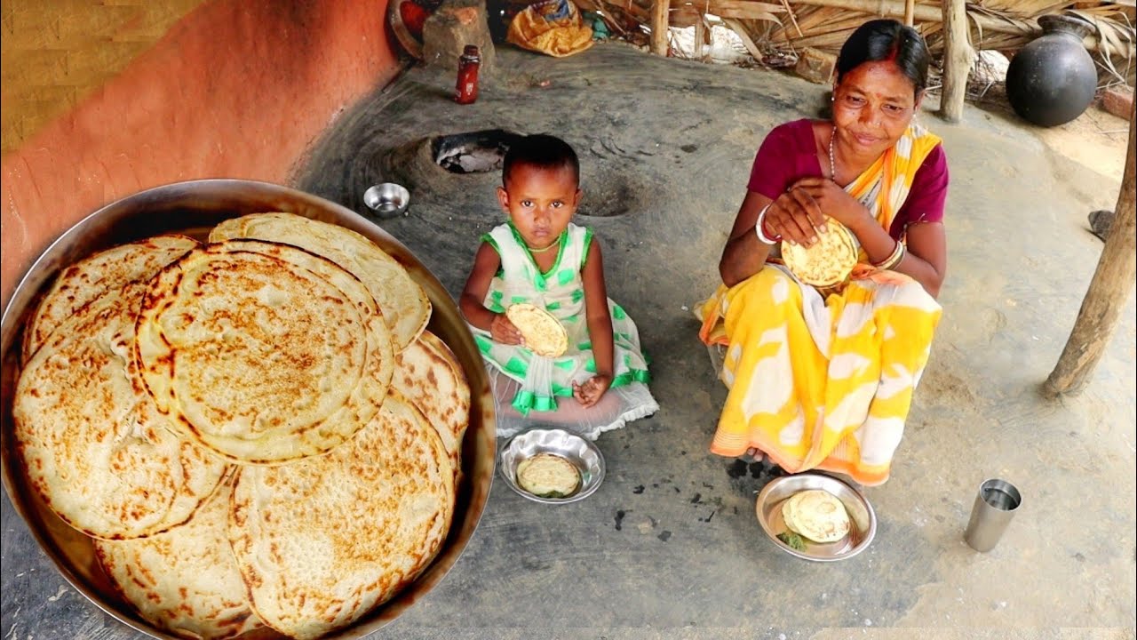 santali tribe mother cooking breakfast for her child||rural village ...