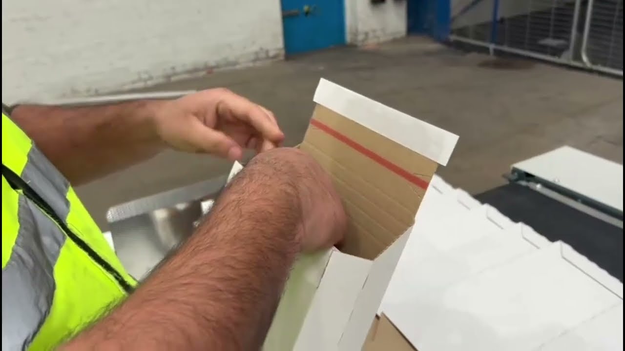 Box Plus 3 Corrugate Envelope machine with tear tape and silicone tape applications for E-commerce..