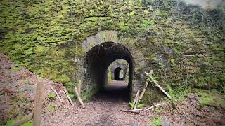 Amazing tram tunnel under massive slate structure