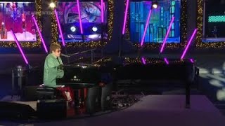 Elton John unveils Saks' holiday display