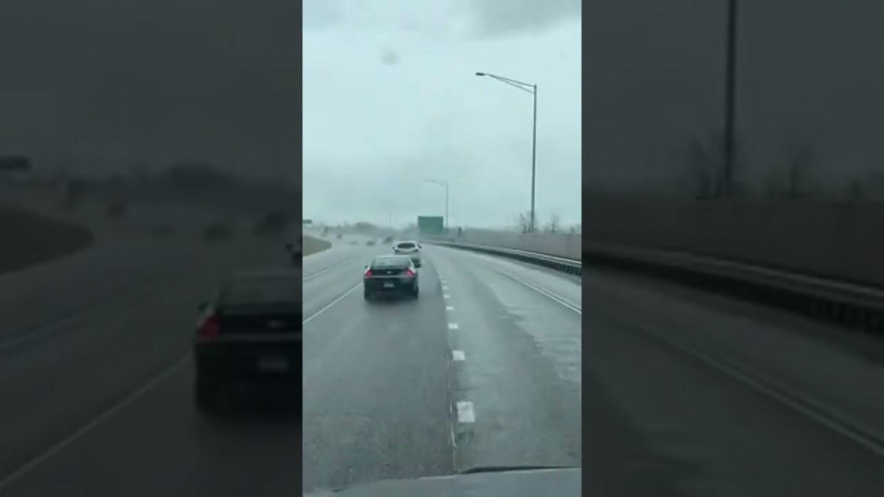 Heart-Stopping Moment: Car Dares to Cut Off Semi in the Rain! 