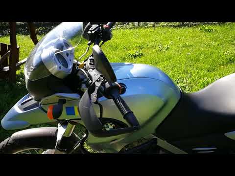 Video: Cum reglezi parbrizul unei motociclete?