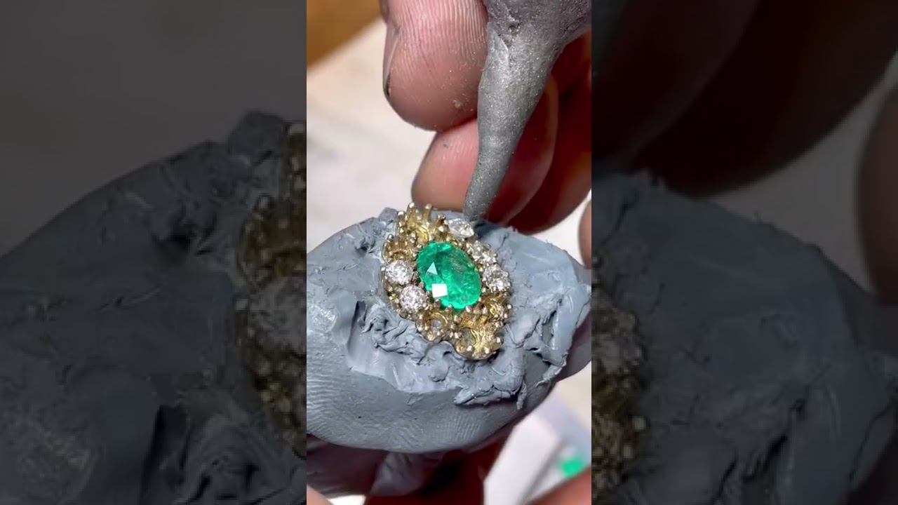 Hand making a vintage oval emerald and diamond gold ring ASMR