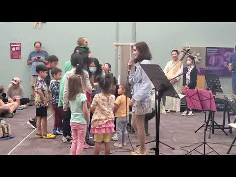 interacting with children Allison Jennings and Hannah Zhang