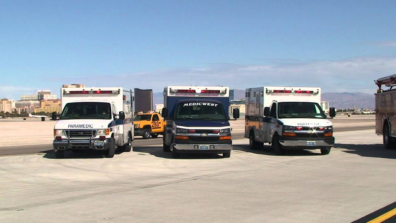 Las Vegas EMS MedicWest Ambulance and AMR Staged with code 3 lights on