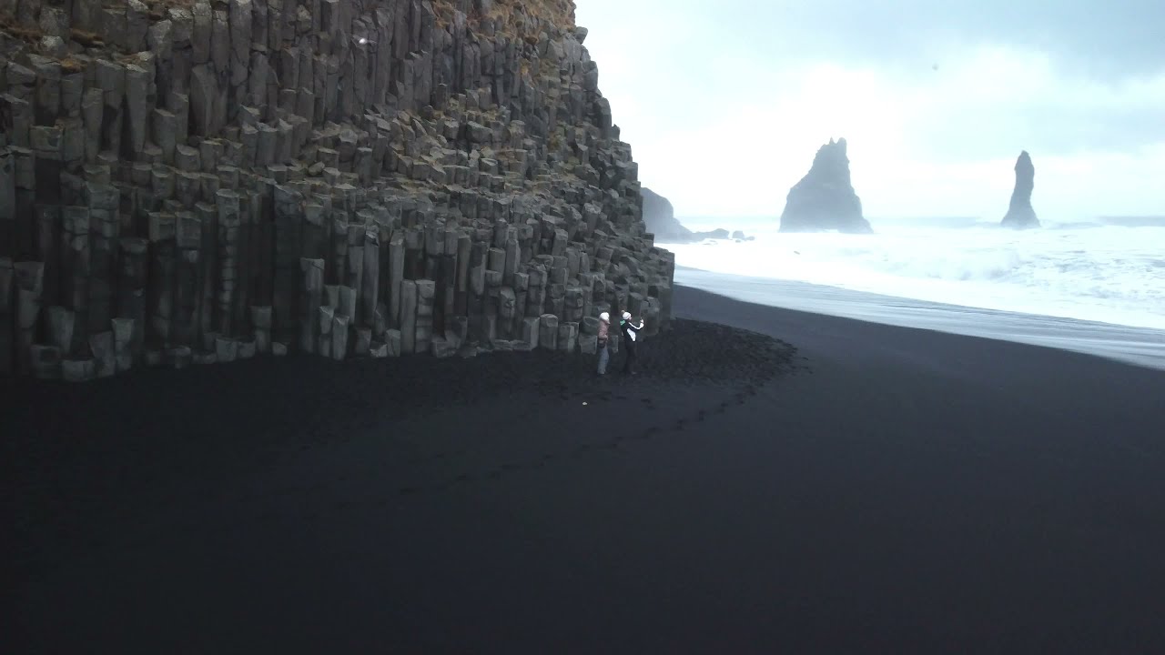 Black sand beach - Reynisfjara in Iceland (nearest village Vik), from drone, winter 2022