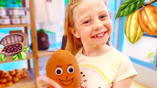 Nastya et Papa ont fait une tournée du cacao pour voir comment le chocolat est fabriqué