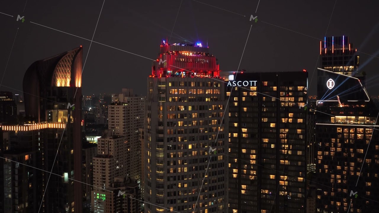Stunning aerial perspective of Bangkok's vibrant cityscape at night. Illuminated modern skyscrapers