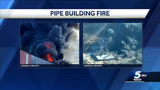 Multiple agencies respond to large fire at pipe building near Seminole
