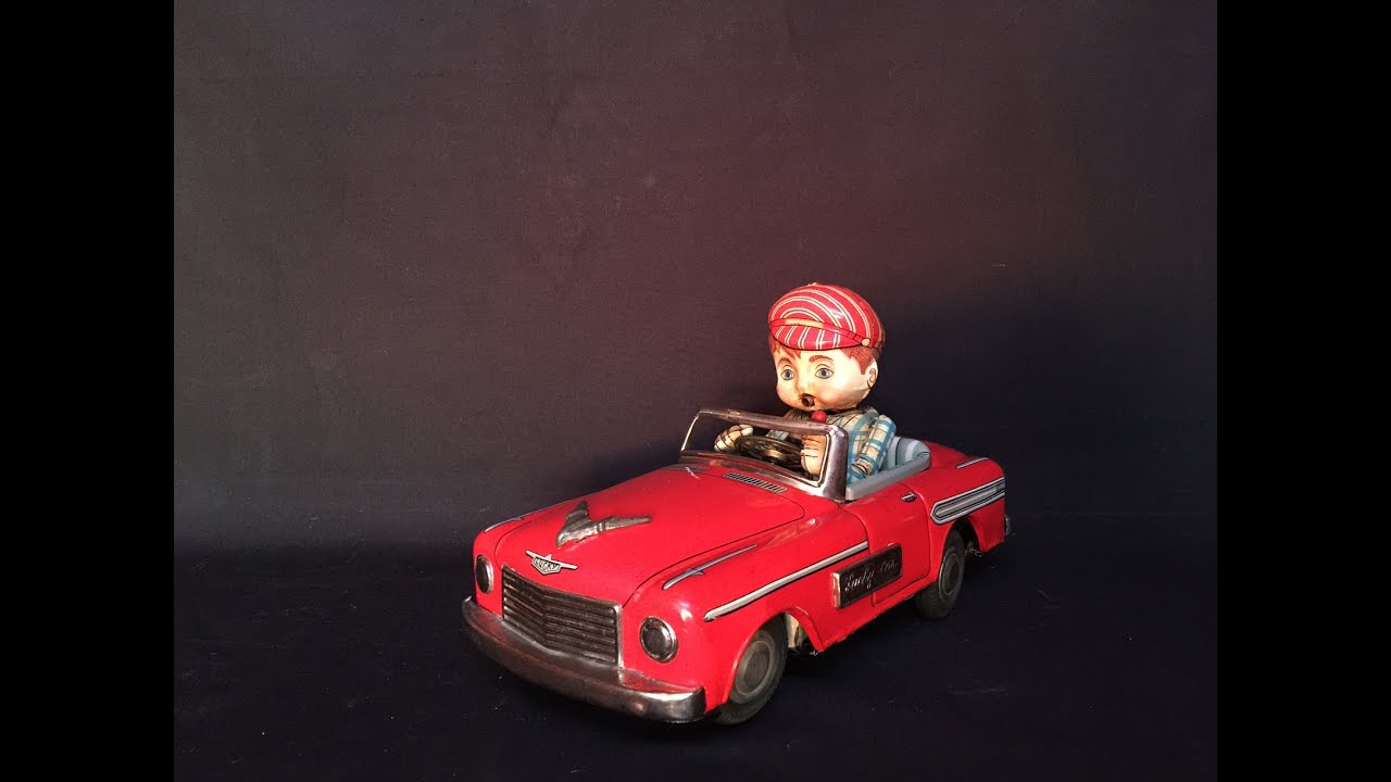 Lucky Car Smoking Japan Battery Operated Tin Toy, Marusan, 1950s