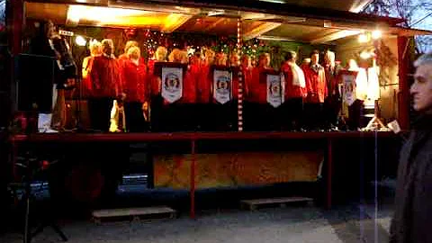 Carolers singing a Christmas song in german.