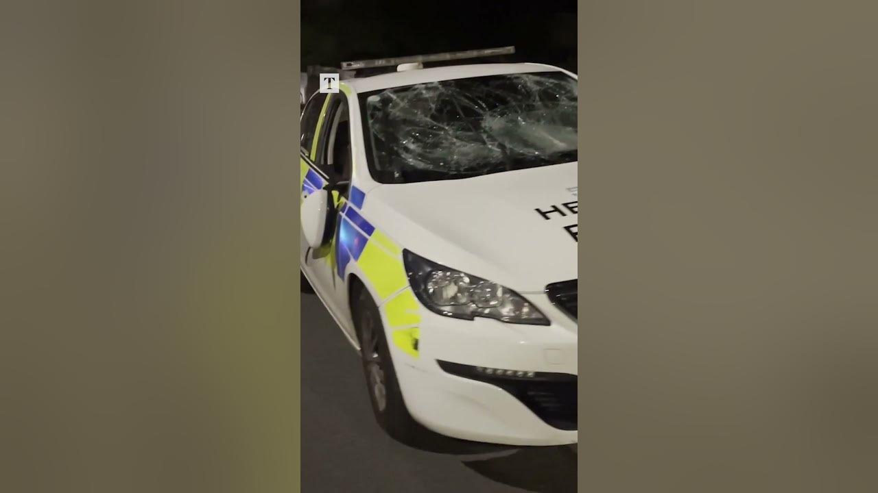 Cars set alight and fireworks hurled at police during riots in Cardiff