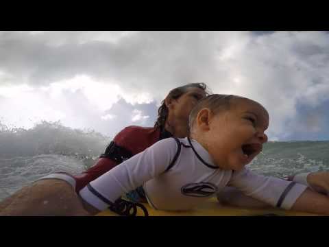 9-month old baby goes YOLO with his surfer daddy into the waves!