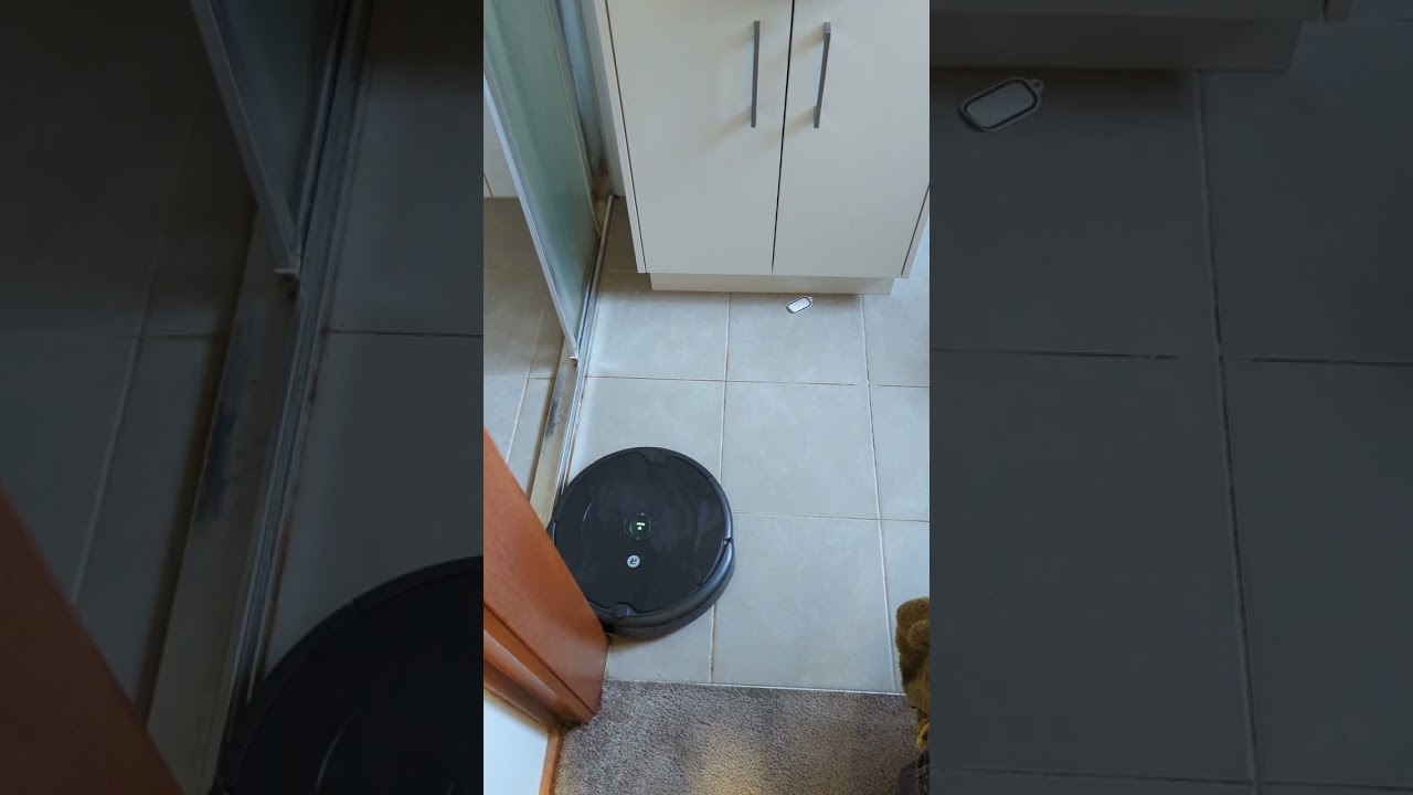 iRobot Roomba 692 Robot Vacuum Small Bathroom Misses Sticker on ground but does a decent job anyway