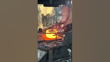 Inside the forging factory Skilled workers forging red-hot steel with perfect teamwork and precision