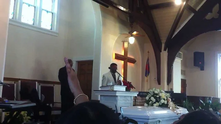 Kelley Stokes Sr. playing the saxophone for his wi...