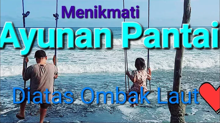 Bermain ayunan diatas ombak tepi pantai. wisata al...