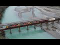 Train 725 crosses the Waimak River - by Drone