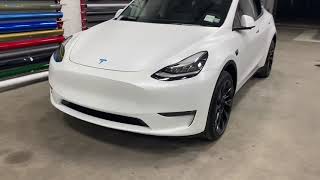 Tesla Model Y Pearl White Multicoat protected with Xpel Stealth with Powder Blue Calipers